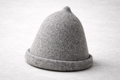Lautva grey wool felt sauna hat on birch wood surface