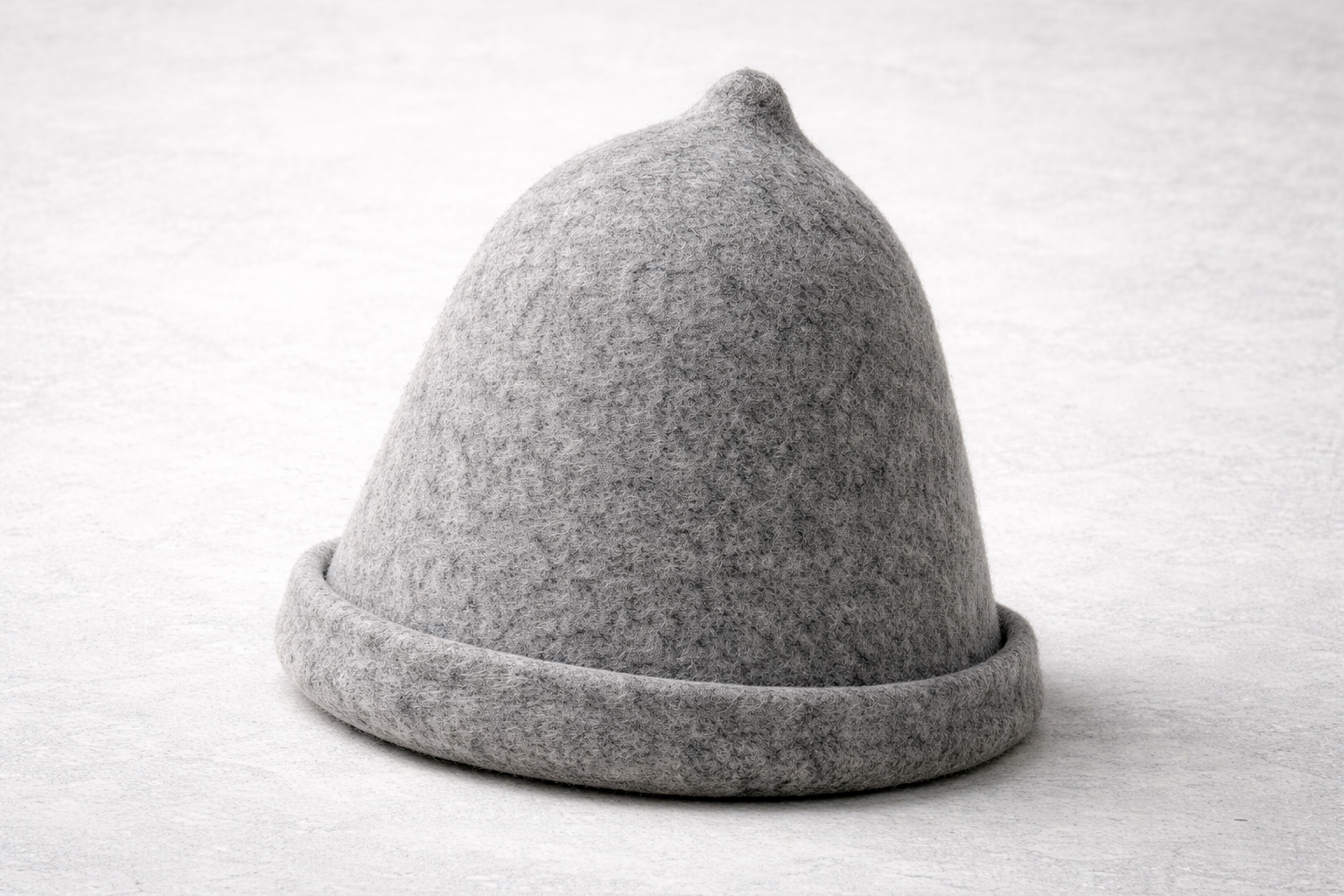 Lautva grey wool felt sauna hat on birch wood surface